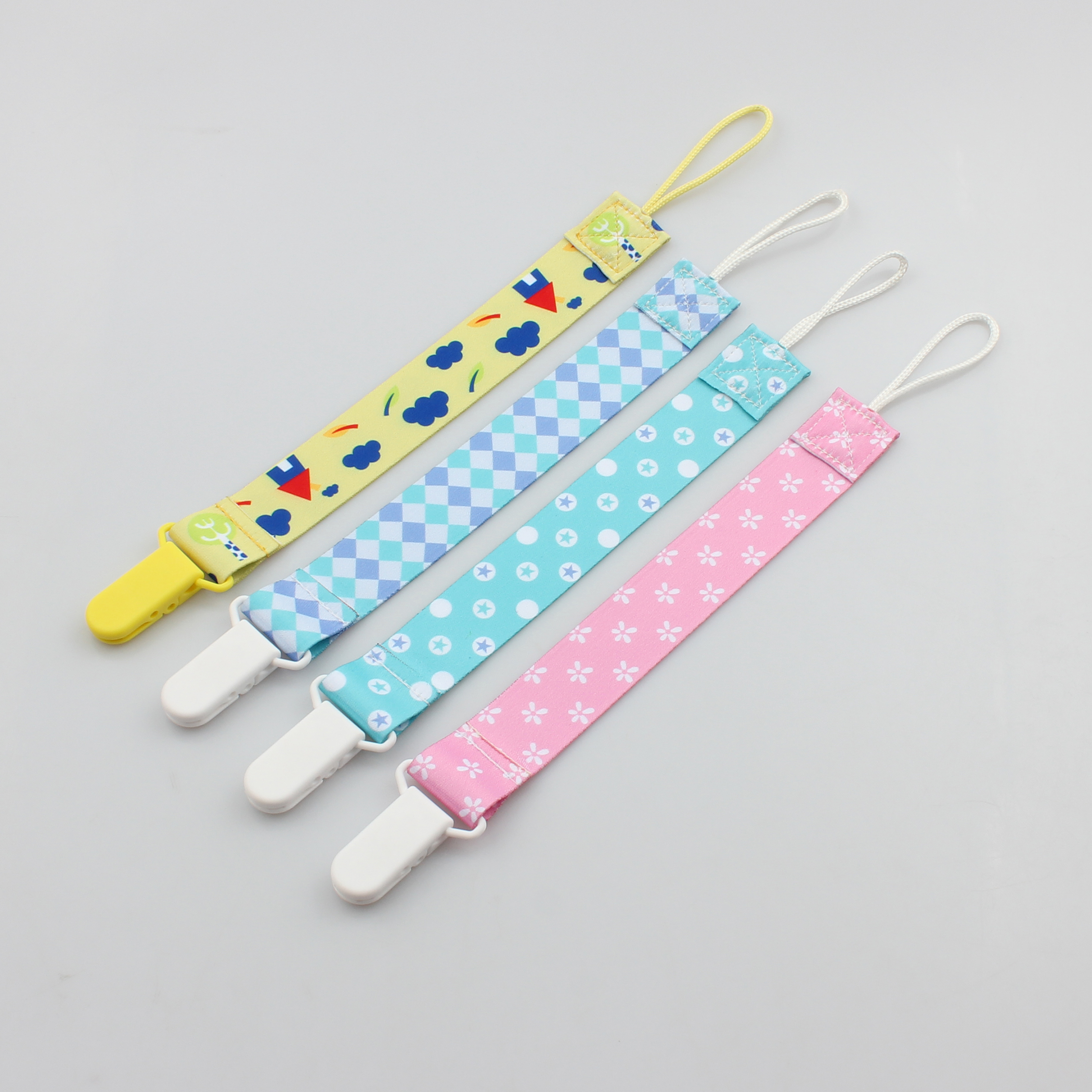 Printed cartoon ribbon baby pacifier clip wholesale Featured Image